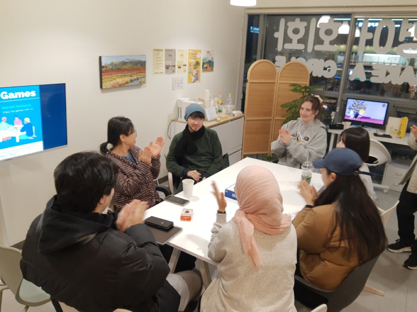 Friends Circle participants sitting together in the Make A Circle space during a guided group activity.